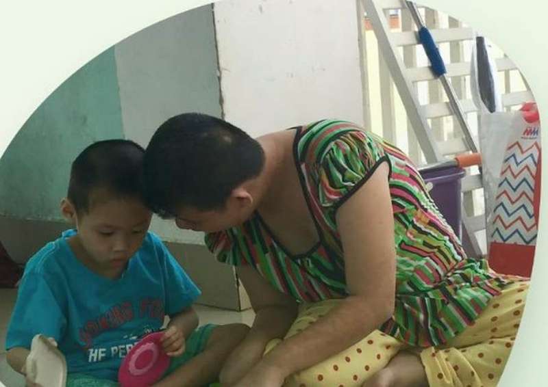A therapist working with a young child during a home visit